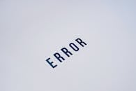 Simple and minimalist image showcasing the word 'ERROR' on a white background.